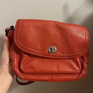 Medium sized coach leather red bag with great condition.